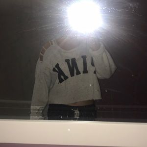 Oversized cropped pink sweatshirt w/ open shoulder